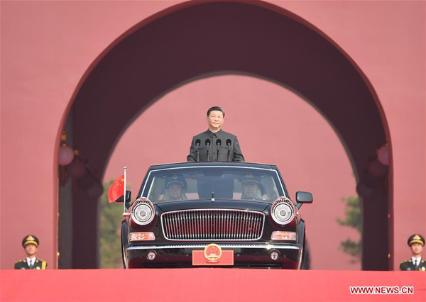 President Xi reviews armed forces on National Day for first time